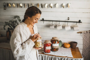 young-woman-cans-and-pickles-vegetables