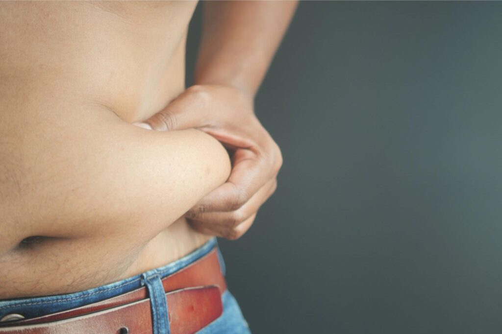 Man-Pinching-Belly-Fat