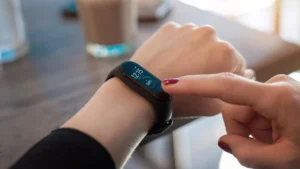 woman-pointing-fitness-tracker